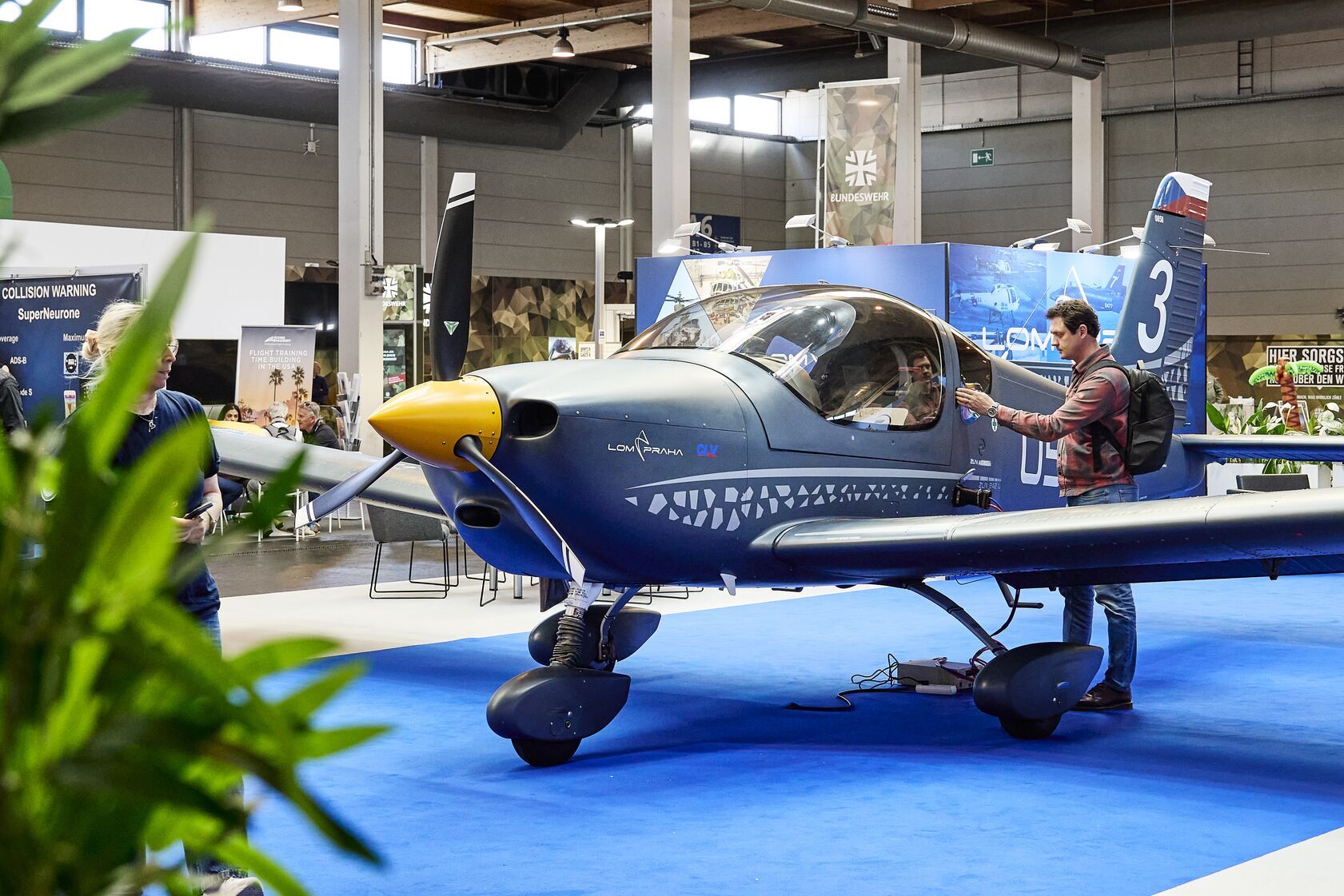 Light aircraft on an exhibition hall stand, AERO 2026