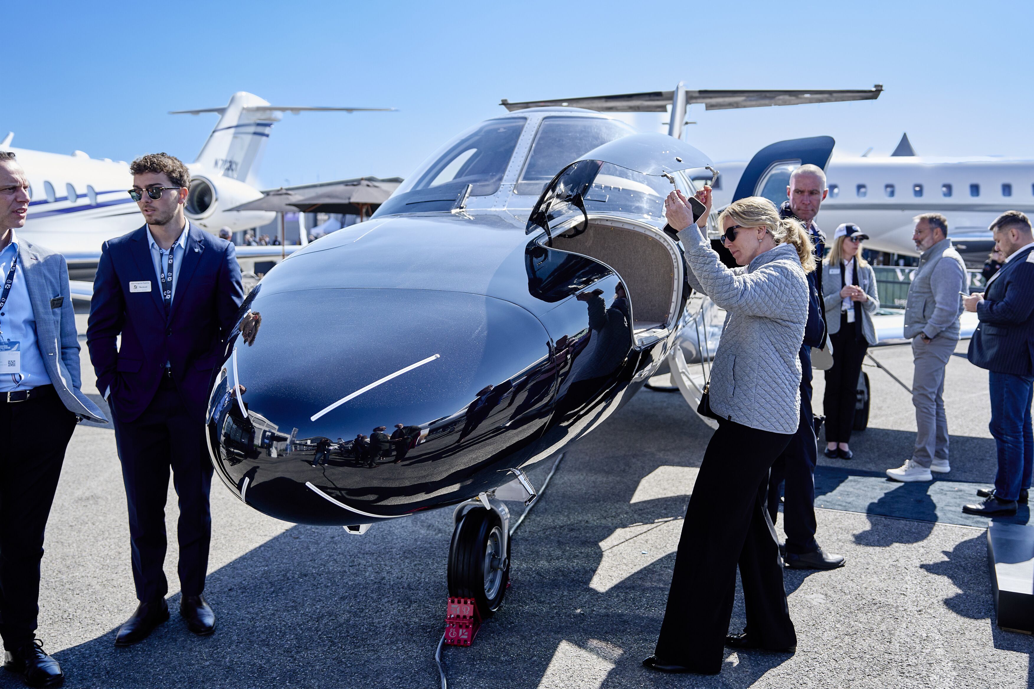 Visitors at a business jet on the static display, AERO 2026